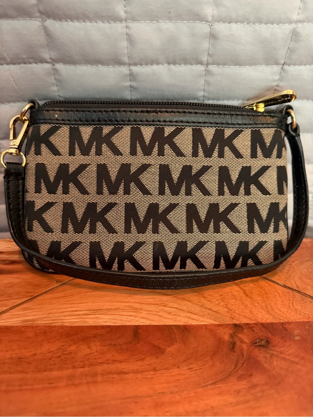 Michael Kors Black Logo Canvas Mini Wristlet with Tan Background